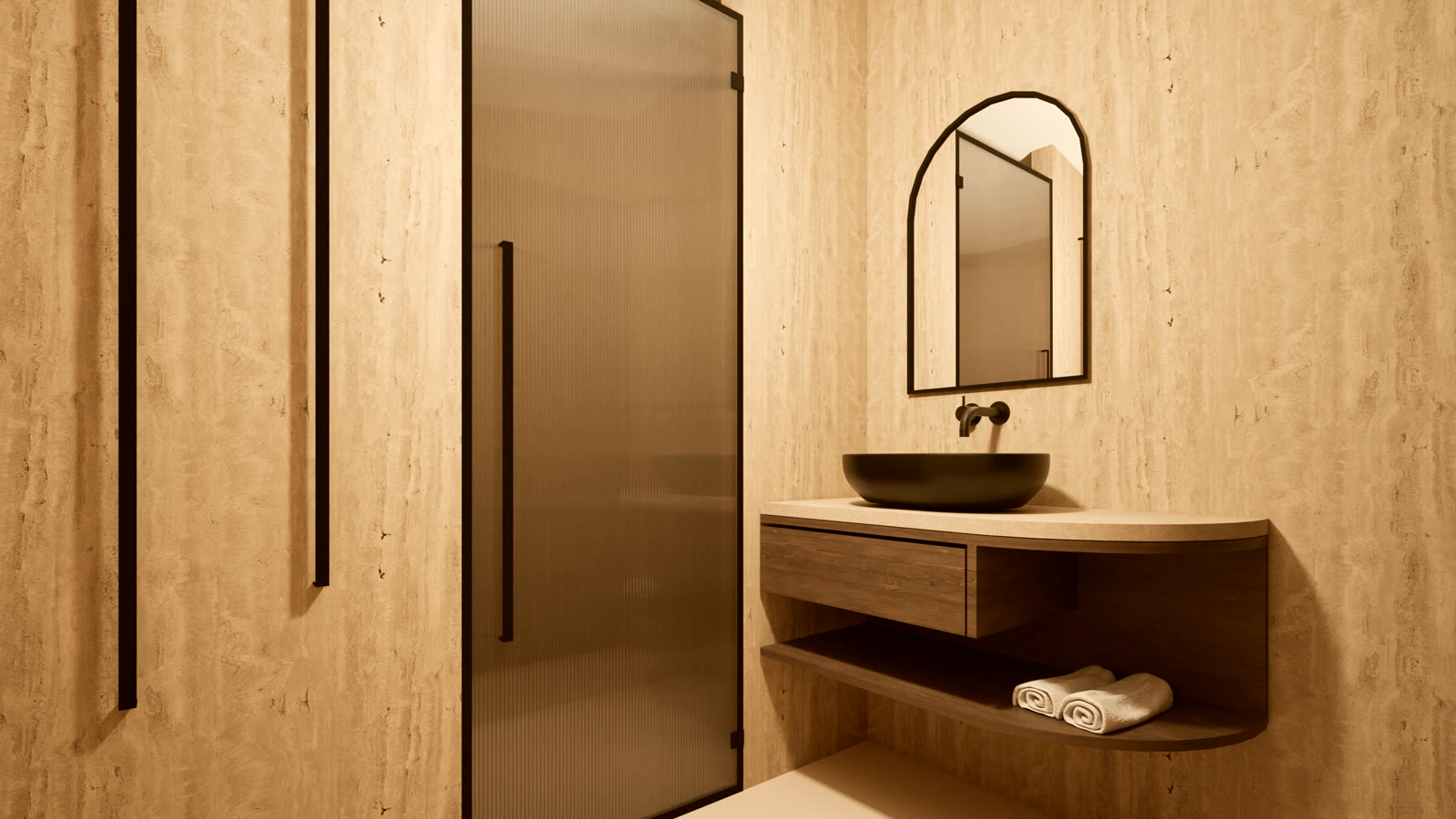Travertine bathroom with a black stone basin, arched mirror and fluted shower screen
